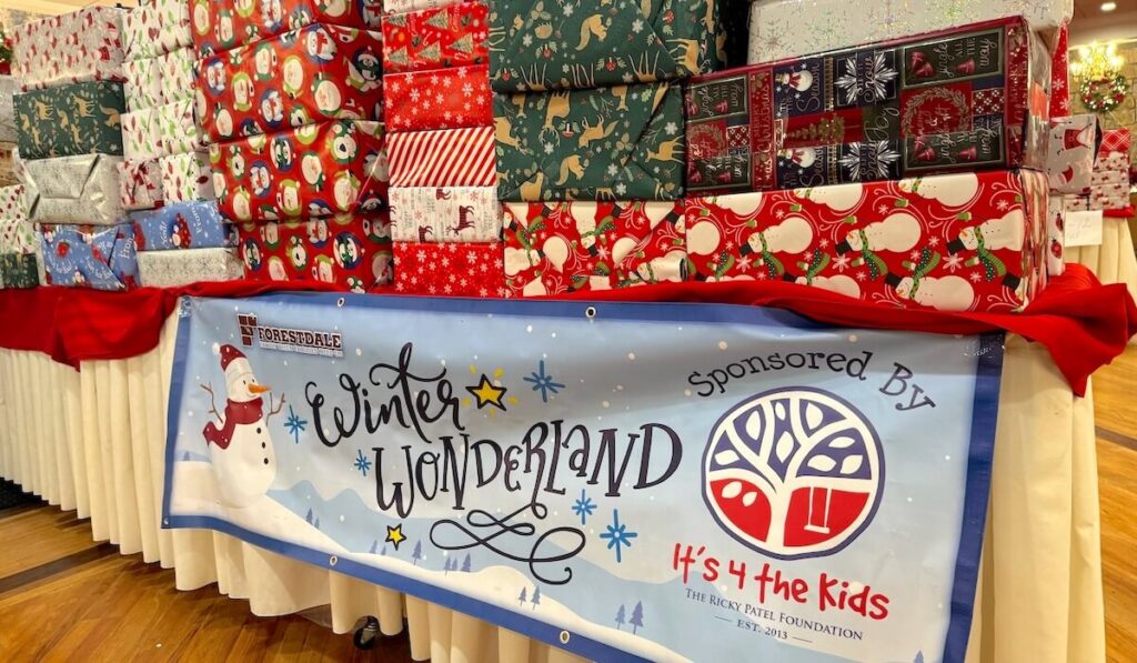 Winter Wonderland toy drive featuring a table full of holiday gifts