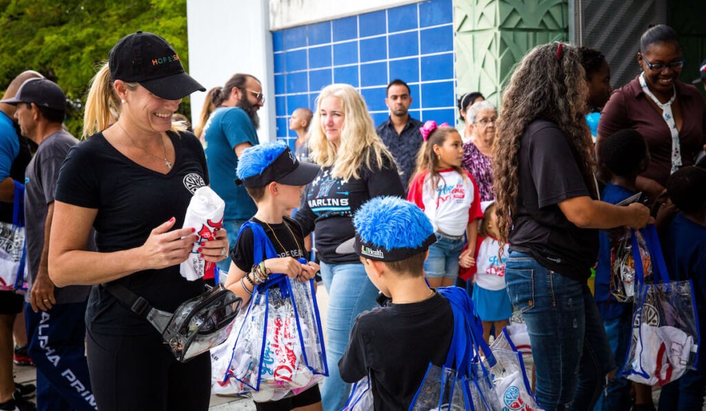 Bags for Hope event featuring kids with bags to fill with things they need